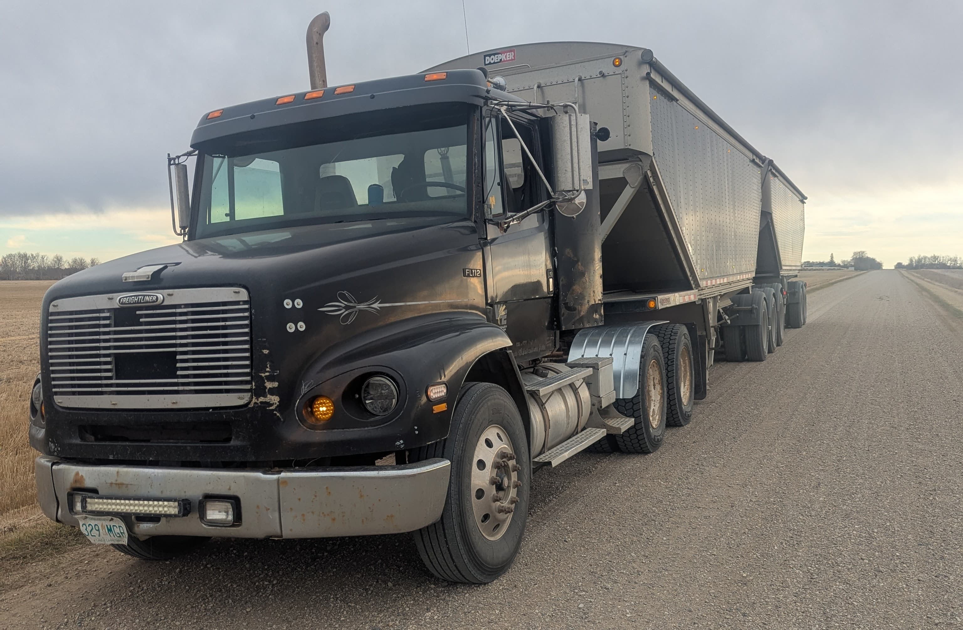 Freightliner truck with Super B trailer on highway
